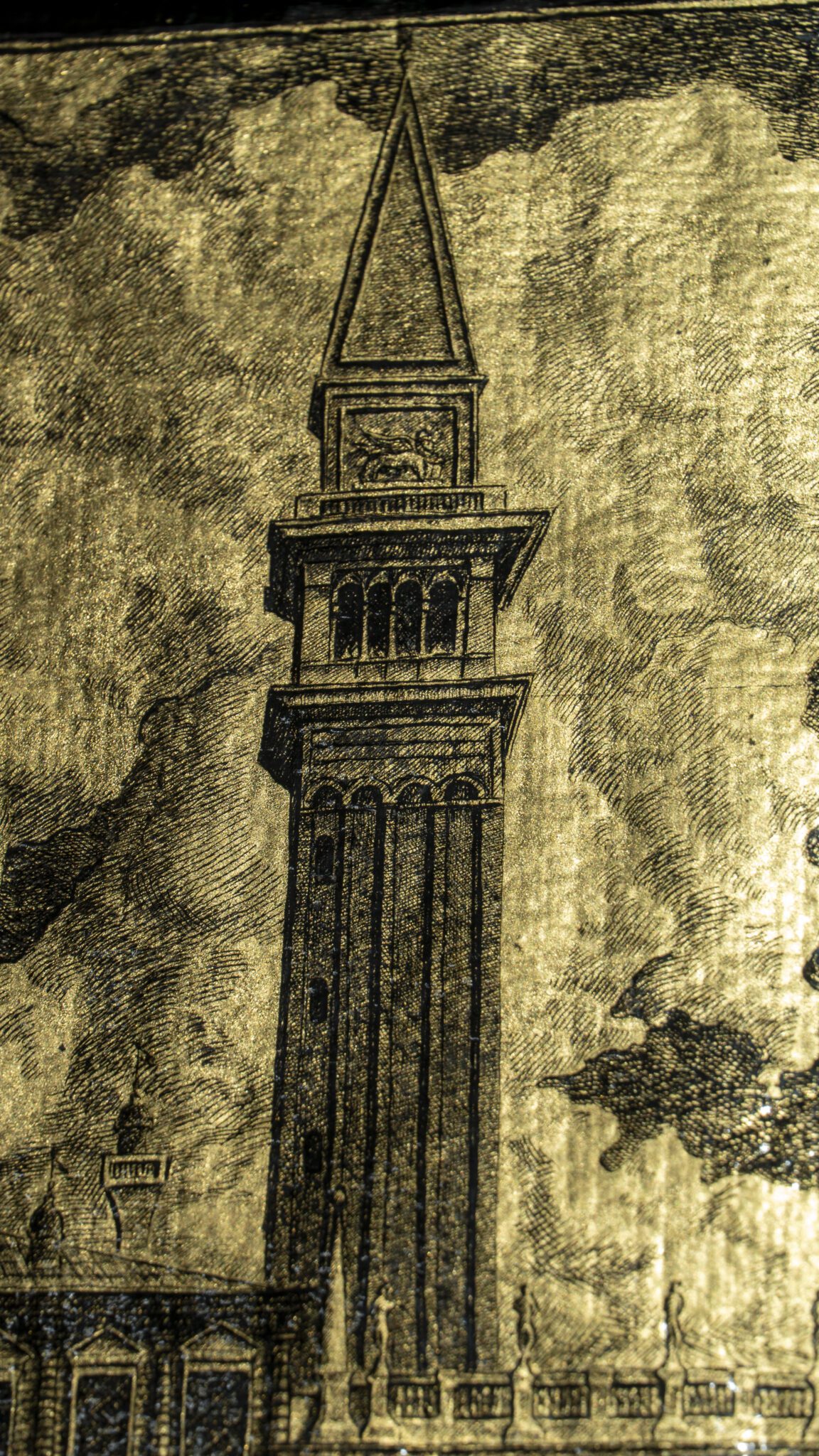 Detail of the artwork “An Icon of Venice”: St Mark’s Campanile, the monumental façade engraved on gold leaf.